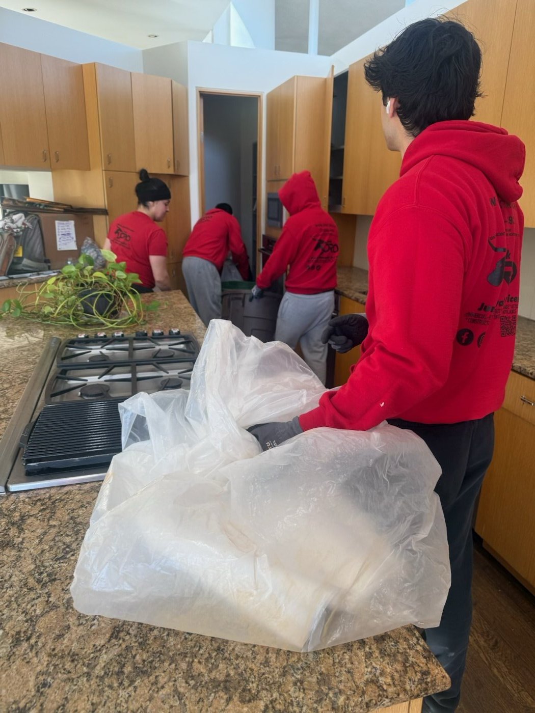 Junk Toro crew clearing a kitchen